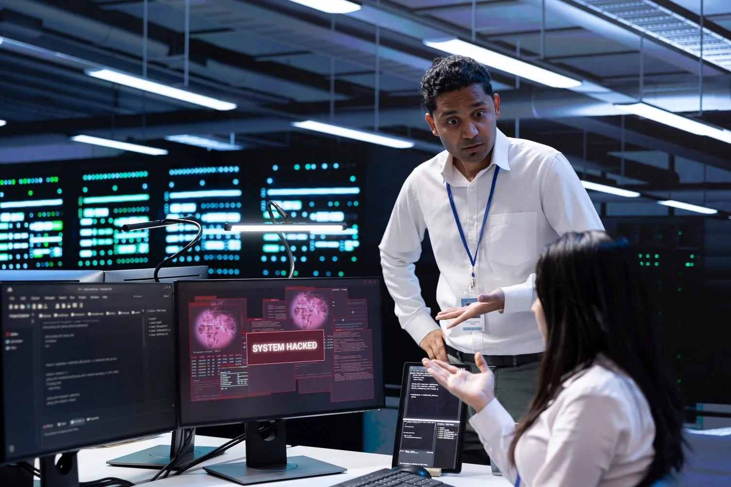 cyber security mistakes a group of people worrying about a breach as their system got hacked due to a cybersecurity mistake